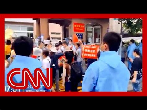 Chinese couple says they were illegally detained and bank cards .